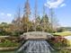 Watergrass community entrance with a waterfall feature at 7135 Graybrook Dr, Wesley Chapel, FL 33545