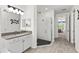 Bathroom with walk-in shower, vanity, and modern fixtures at 7135 Graybrook Dr, Wesley Chapel, FL 33545