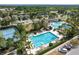 Aerial view of community pool, tennis courts, and clubhouse at 7135 Graybrook Dr, Wesley Chapel, FL 33545