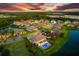 Bird's eye view of a luxury home community near a lake at 7135 Graybrook Dr, Wesley Chapel, FL 33545