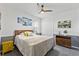 Cozy bedroom with wood accents and neutral decor at 7135 Graybrook Dr, Wesley Chapel, FL 33545