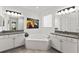 Primary bathroom with corner soaking tub and double vanities at 7135 Graybrook Dr, Wesley Chapel, FL 33545