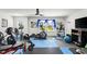 Home gym with various exercise equipment and flooring at 7135 Graybrook Dr, Wesley Chapel, FL 33545
