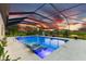 Stunning sunset view from this screened-in pool and spa area at 7135 Graybrook Dr, Wesley Chapel, FL 33545