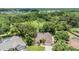 Expansive aerial view of the home, showing the roof, backyard, and surrounding greenery at 3501 Country Creek Ln, Valrico, FL 33596