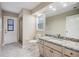 Tiled bathroom with granite counters, a shower, and a door to the outside at 3501 Country Creek Ln, Valrico, FL 33596