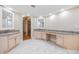 Spacious bathroom offers dual sinks with granite counters and access to walk in closet at 3501 Country Creek Ln, Valrico, FL 33596