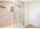 This bathroom has a glass shower with tiled walls and a convenient shower caddy at 3501 Country Creek Ln, Valrico, FL 33596