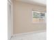 Bright bedroom featuring a window offering ample natural light and spacious closet at 3501 Country Creek Ln, Valrico, FL 33596