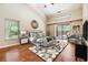 Spacious bedroom with hardwood floors and a view of the outdoor pool area at 3501 Country Creek Ln, Valrico, FL 33596