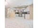 Modern kitchen with sleek white cabinets, granite countertops, and stainless steel appliances at 3501 Country Creek Ln, Valrico, FL 33596