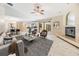 Living room featuring a fireplace and view to the kitchen, dining area, and outdoor living at 3501 Country Creek Ln, Valrico, FL 33596