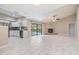 Living room featuring a fireplace and view to the outdoor pool area at 3501 Country Creek Ln, Valrico, FL 33596