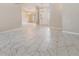 Light and airy living room featuring tile floors and modern lighting fixtures at 3501 Country Creek Ln, Valrico, FL 33596