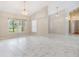 Spacious living area with tile floors and natural light coming from the large window at 3501 Country Creek Ln, Valrico, FL 33596