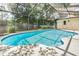 Inviting pool area with a full screen enclosure and well-maintained landscaping at 3501 Country Creek Ln, Valrico, FL 33596