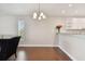 Dining area with hardwood floors and a chandelier at 8693 Bardmoor Blvd # 308B, Seminole, FL 33777