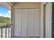 White louvered doors conceal storage space on this condo balcony at 8693 Bardmoor Blvd # 308B, Seminole, FL 33777
