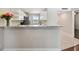 Kitchen with granite countertop and breakfast bar at 8693 Bardmoor Blvd # 308B, Seminole, FL 33777