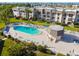 Inviting community pool with plenty of lounge chairs and a hot tub at 8693 Bardmoor Blvd # 308B, Seminole, FL 33777
