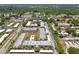 Aerial perspective showcasing a large apartment complex with a swimming pool and ample parking at 8693 Bardmoor Blvd # 308B, Seminole, FL 33777