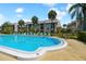 Community pool with ample lounge chairs for relaxation at 8693 Bardmoor Blvd # 308B, Seminole, FL 33777