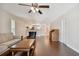 Hardwood floor living room with open concept to kitchen and view of balcony at 8693 Bardmoor Blvd # 308B, Seminole, FL 33777