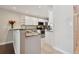 Modern kitchen with granite countertops and white cabinets at 8693 Bardmoor Blvd # 308B, Seminole, FL 33777