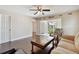 Living room with hardwood floors, comfy seating, and access to a balcony at 8693 Bardmoor Blvd # 308B, Seminole, FL 33777