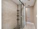 Shower stall with tiled walls and pebble floor at 8693 Bardmoor Blvd # 308B, Seminole, FL 33777
