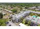 Aerial view of a community with various apartment buildings, a pool, and lush landscaping at 8693 Bardmoor Blvd # 308B, Seminole, FL 33777