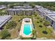 Aerial view of community pool and surrounding buildings at 8693 Bardmoor Blvd # 308B, Seminole, FL 33777