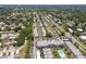 Wide aerial view of a neighborhood featuring numerous houses and tree-lined streets at 8693 Bardmoor Blvd # 308B, Seminole, FL 33777