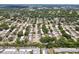 Aerial view of a residential area with houses, roads, and a significant amount of green space at 8693 Bardmoor Blvd # 308B, Seminole, FL 33777