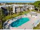 Aerial view of community pool and surrounding buildings at 8693 Bardmoor Blvd # 308B, Seminole, FL 33777