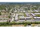 An aerial shot of an apartment building complex, highlighting its layout and surrounding neighborhood at 8693 Bardmoor Blvd # 308B, Seminole, FL 33777