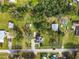 Aerial view of the property surrounded by lush greenery showcasing the expansive lot at 510 Tighe Ave, Seffner, FL 33584