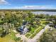 Aerial view of a charming two-story home with a spacious yard and serene surroundings near a lake at 510 Tighe Ave, Seffner, FL 33584