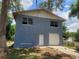 Two-story home featuring a garage, unfinished upper story, block construction, and a lawn at 510 Tighe Ave, Seffner, FL 33584