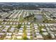 Aerial view of a manufactured home community with a lake at 5353 Comanche St, Zephyrhills, FL 33542