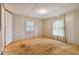 Simple bedroom with laminate flooring and a closet at 5353 Comanche St, Zephyrhills, FL 33542