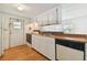 Kitchen with white cabinets and wood countertops at 5353 Comanche St, Zephyrhills, FL 33542