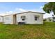 Mobile home with spacious backyard and mature trees at 5353 Comanche St, Zephyrhills, FL 33542