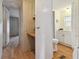 Clean bathroom with white cabinets and a toilet at 5353 Comanche St, Zephyrhills, FL 33542
