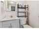 Clean bathroom with white vanity, toilet and shower at 5353 Comanche St, Zephyrhills, FL 33542