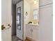 Small bathroom with white vanity and mirror at 5353 Comanche St, Zephyrhills, FL 33542