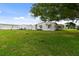 Mobile home with a large backyard and shed at 5353 Comanche St, Zephyrhills, FL 33542