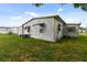 Mobile home with large backyard and mature trees at 5353 Comanche St, Zephyrhills, FL 33542