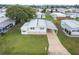 Mobile home in a community setting with green spaces at 5353 Comanche St, Zephyrhills, FL 33542