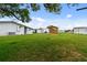 Large backyard with mobile home and shed at 5353 Comanche St, Zephyrhills, FL 33542